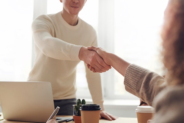 people shaking hands during tenant screening